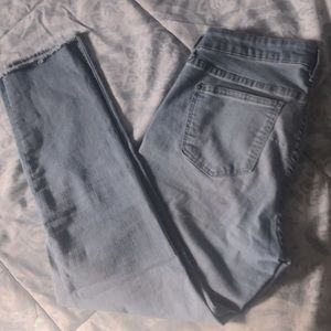 Raw hem light blue jeans